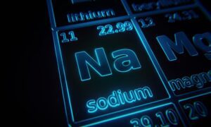 The chemical element of sodium illuminated in a periodic table.